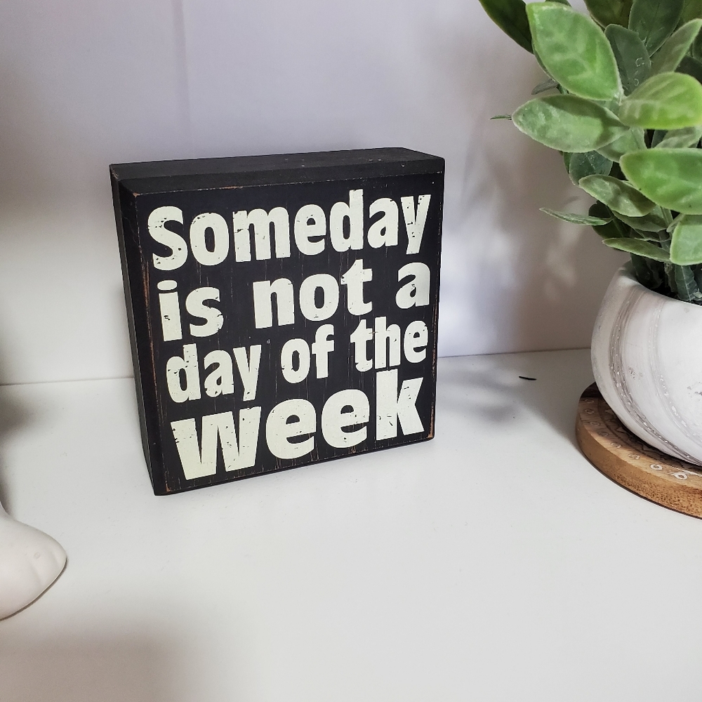 Someday is not a day of the week motivational quote sign.